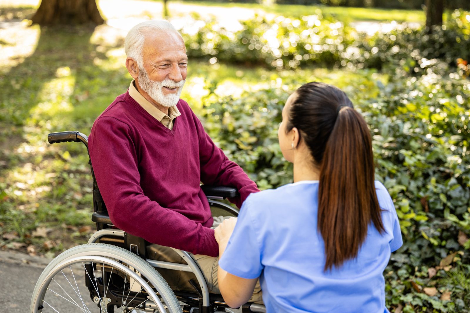 Caregiver assisting a veteran with mobility support in a Keller, TX home.